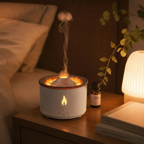 Flame aroma diffuser glowing warm on a nightstand with a mist plume